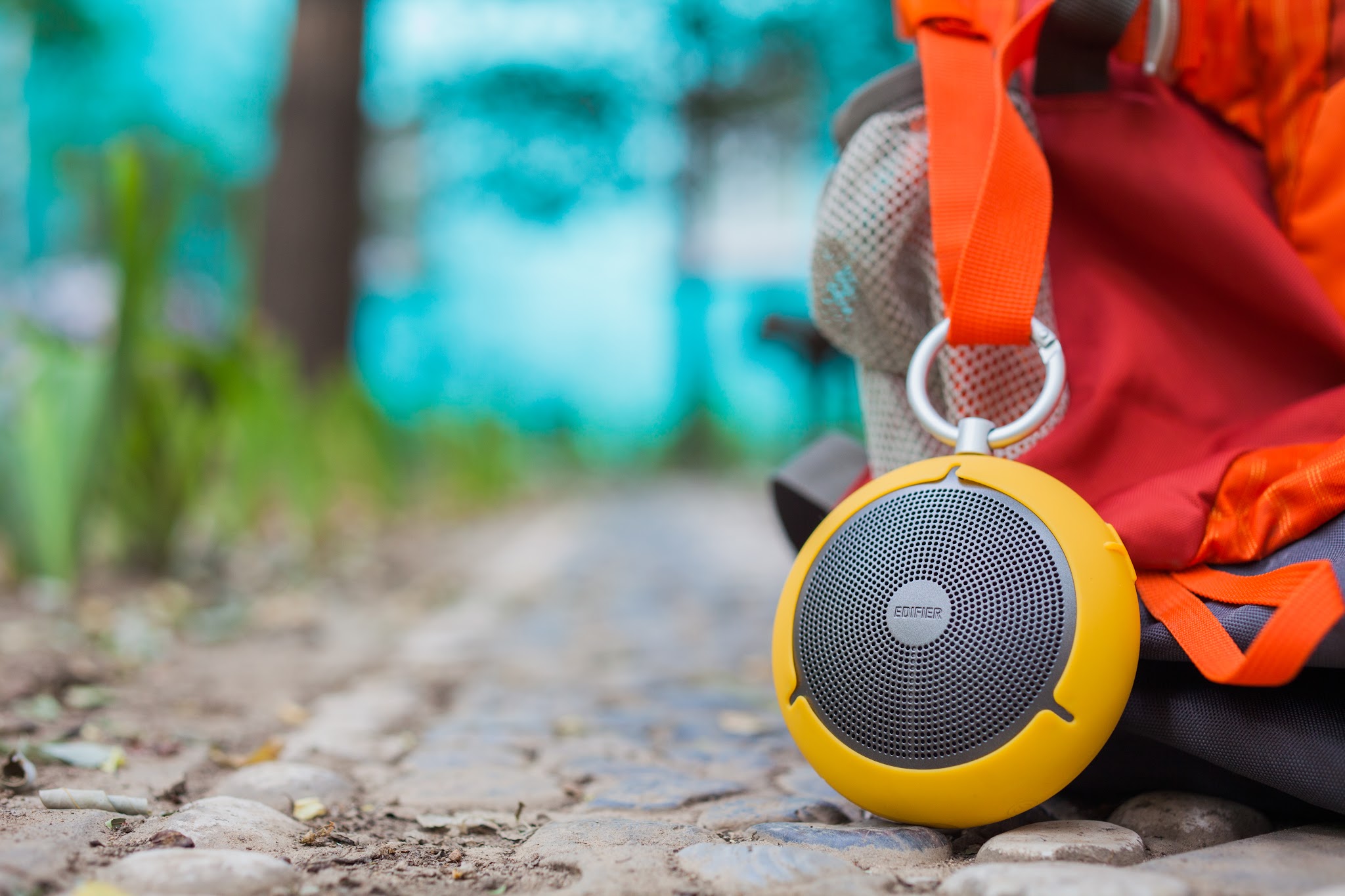 Portable outdoor speaker attached to a backpack